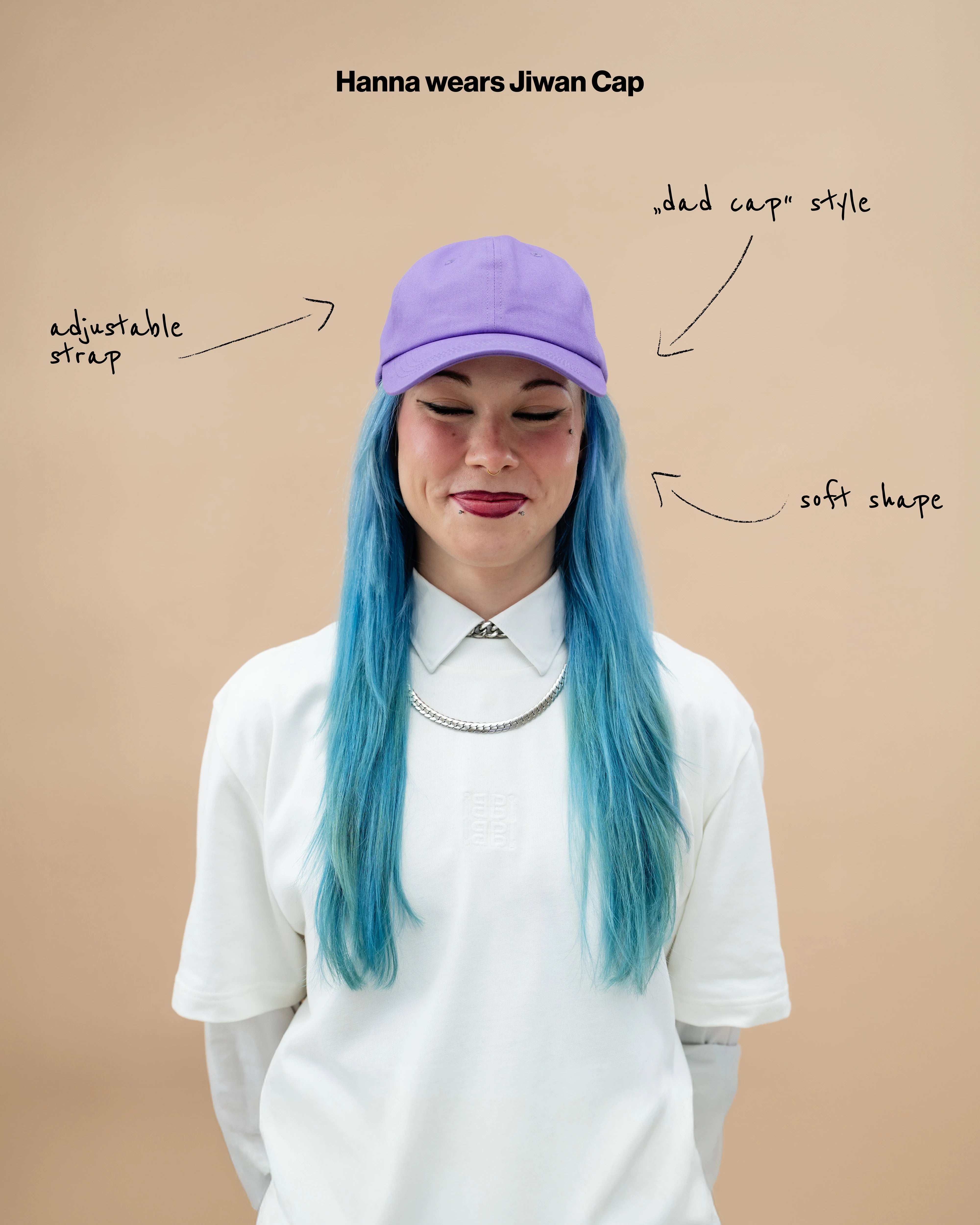 Model wearing a lilac Biweekly cap, front view against a beige background with text: "adjustable straps, dad cap style, soft shape" arranged with arrows