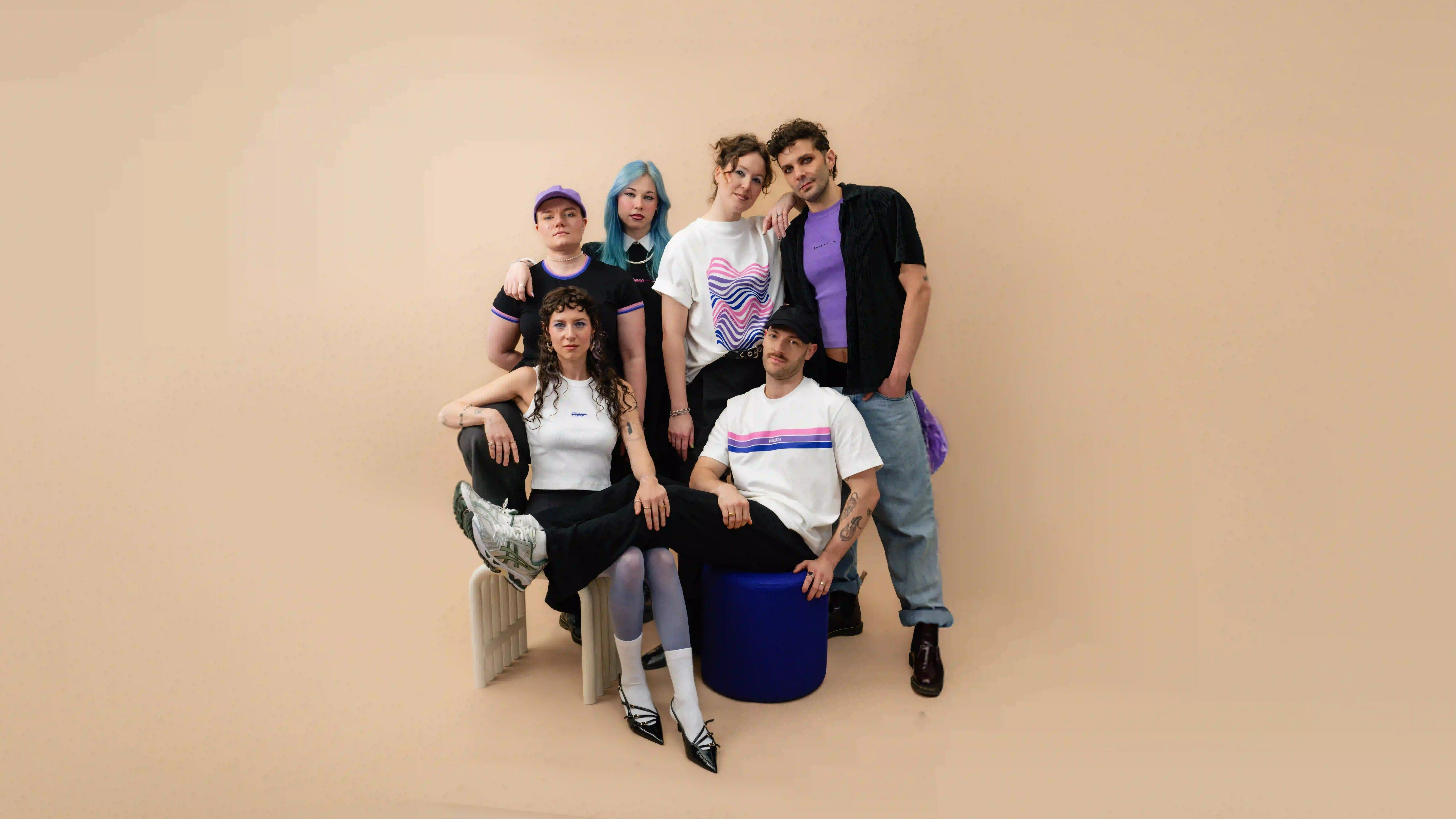 Grouppicture of diverse people wearing Biweekly clothes