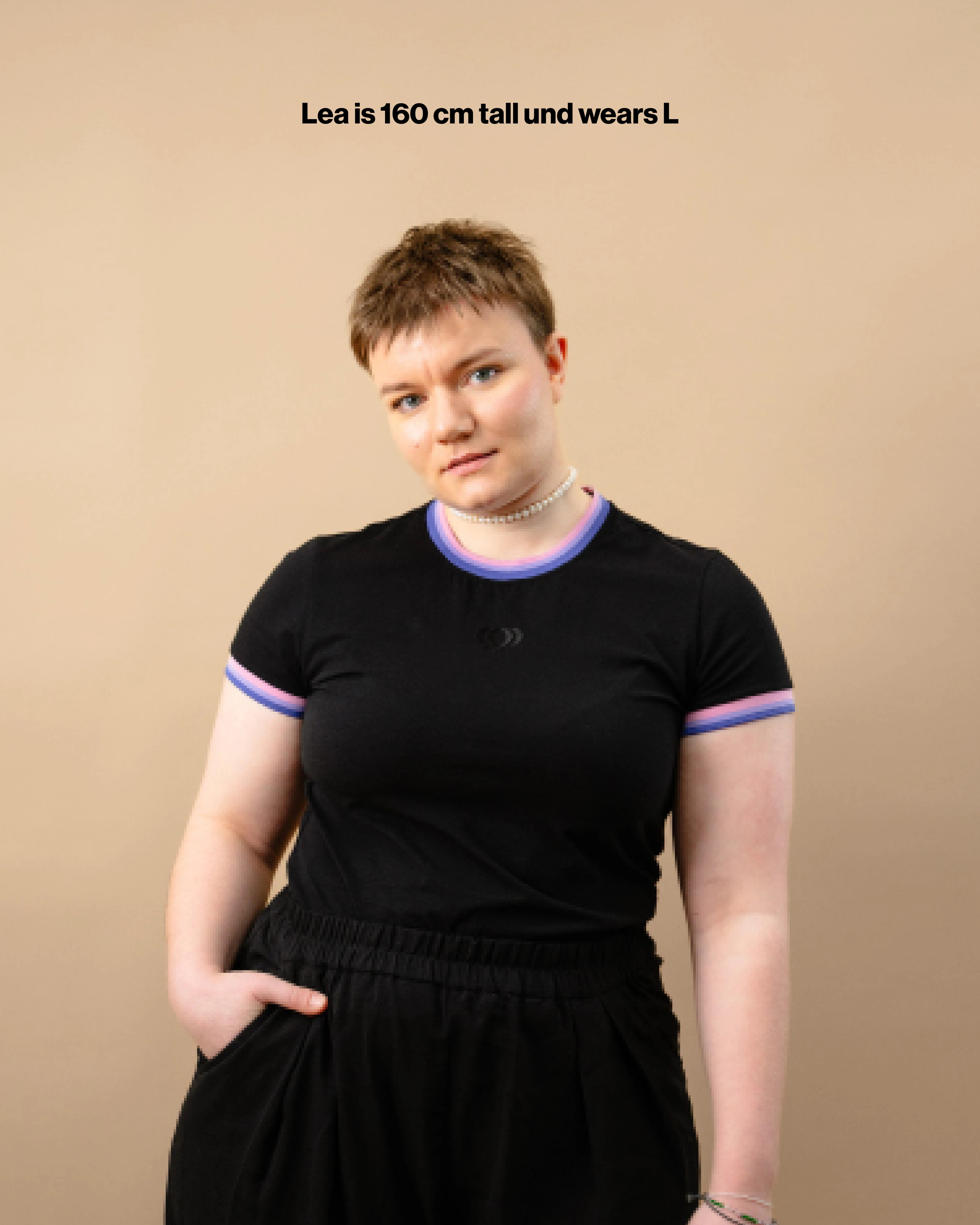 Model wearing a black Biweekly tank top with bi flag colored stripes on the neck and sleeves, front view against a beige background with the text "Lea is 160 cm tall and wears L"