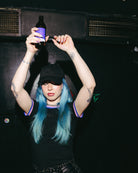 Model wearing a black Biweekly cap, front view, dancing in a club scenario