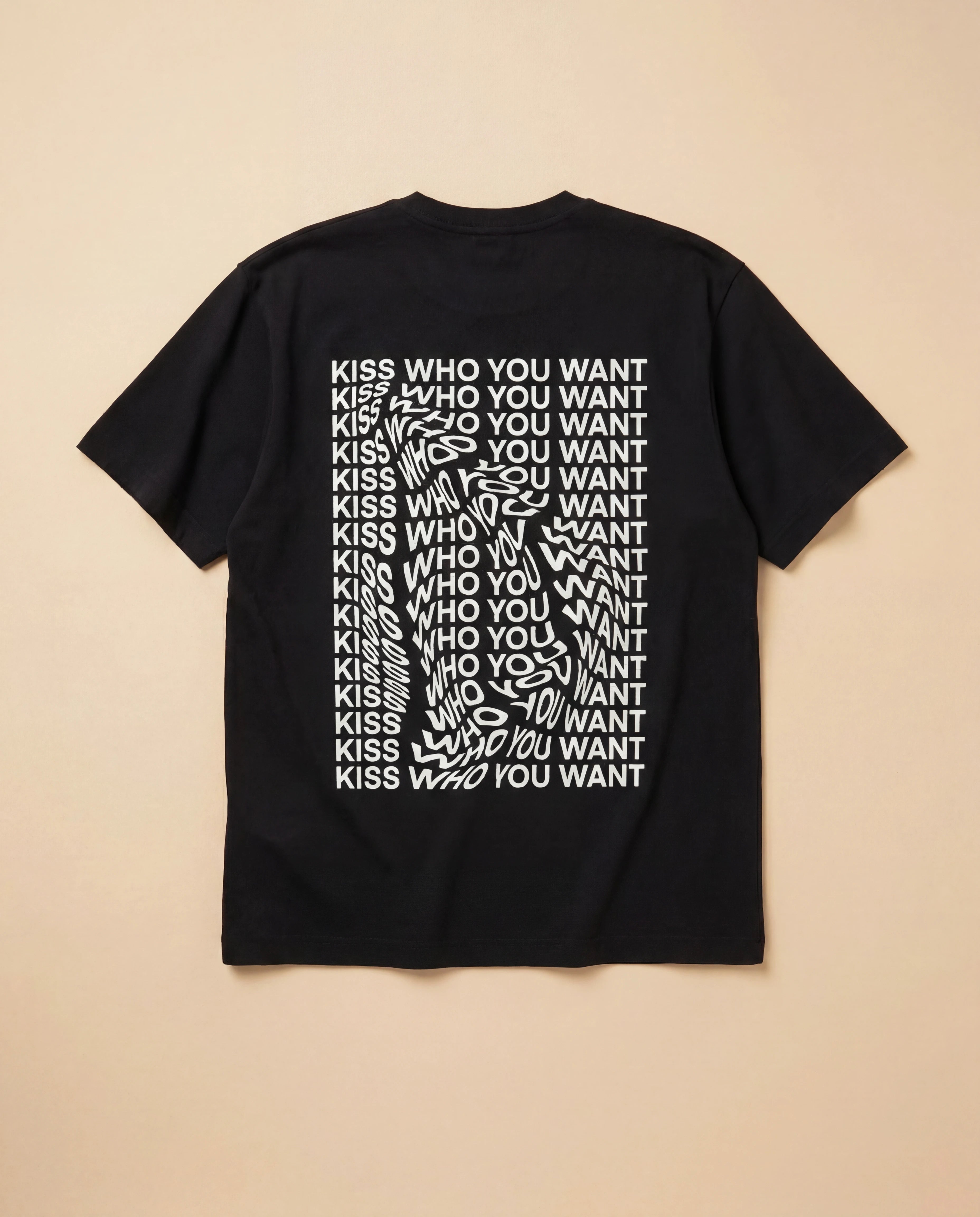 Black oversized Biweekly T-shirt with distorted repeated ‘Kiss Who You Want’ text print, back view, laying flat against a beige background