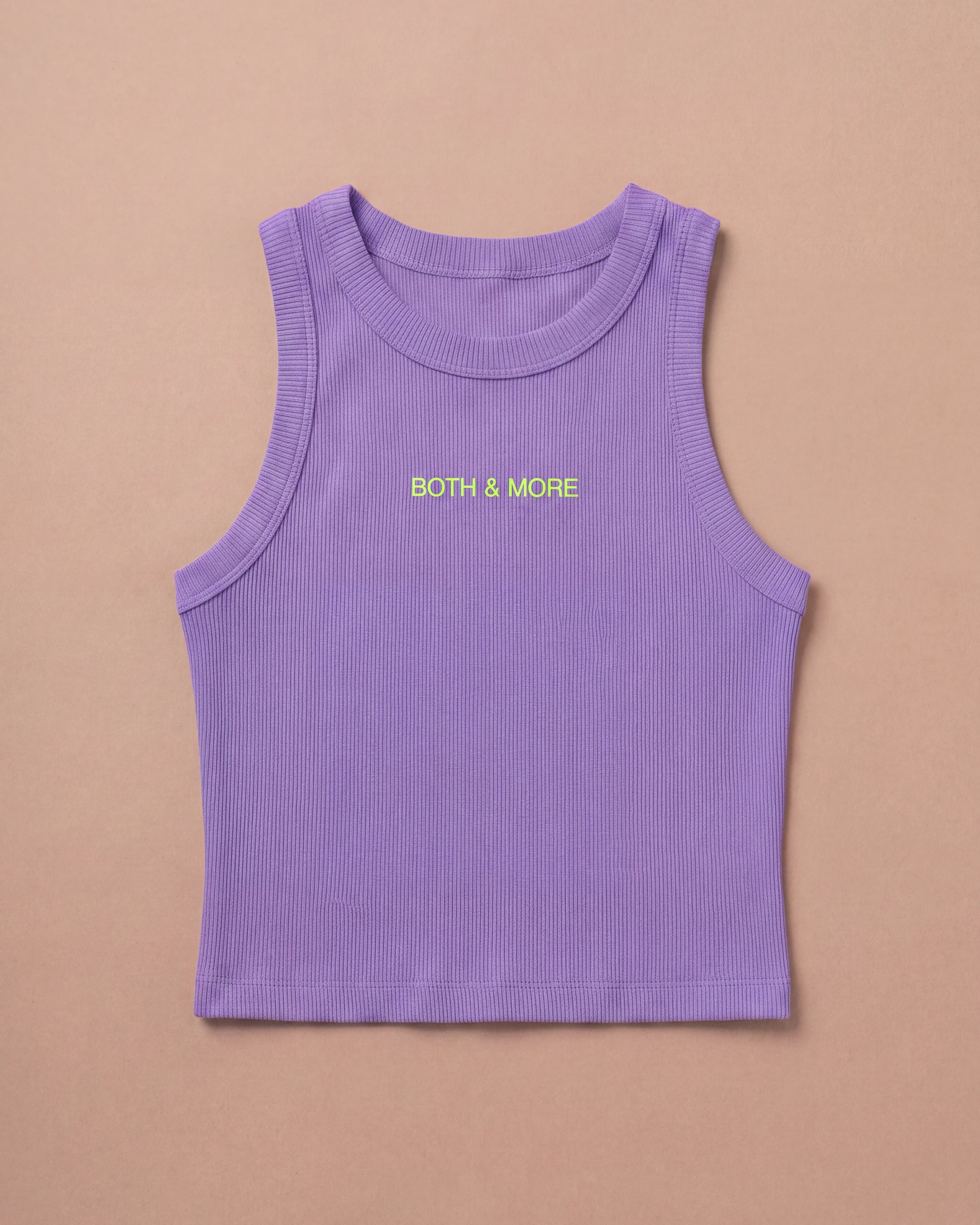 Lilac Biweekly tank top with yellow ‘BOTH & MORE’ text laying flat on beige background