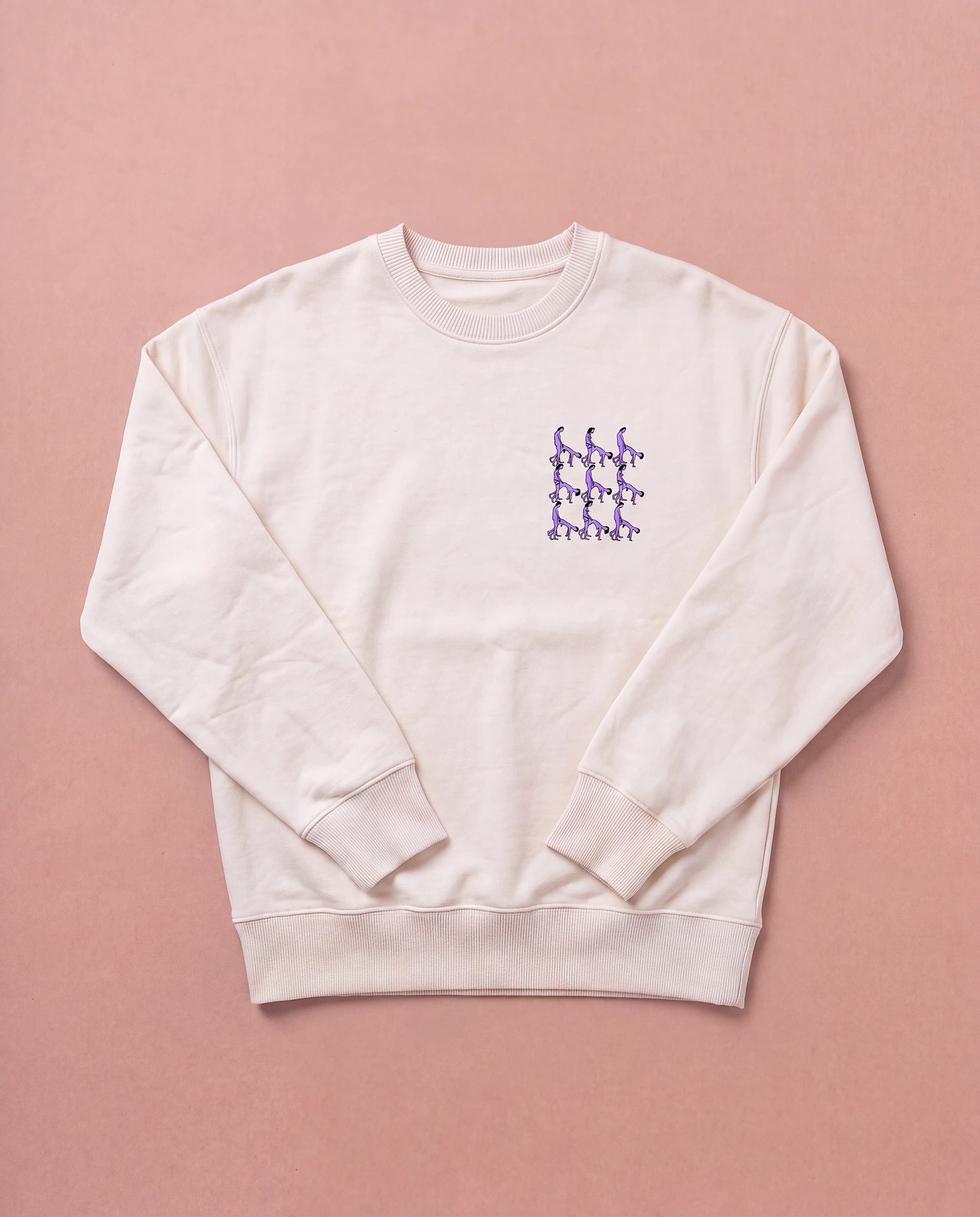 Beige Biweekly crewneck with lilac playful spicy graphic print on right chest area, front view, laying flat on a beige background