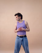 Model wearing a lilac Biweekly tank top with a yellow ‘BOTH & MORE’ text that is crossed out, full body shot front view against a beige background